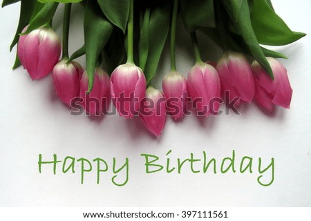 Happy Birthday in green text with bunch of pink tulips