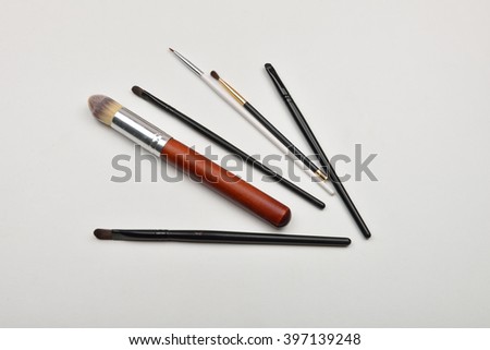 Picture of professional makeup brushes on white background