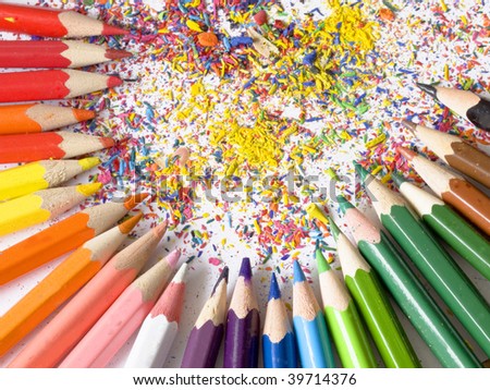 arrangement made of many colorful pencils and shaving on white