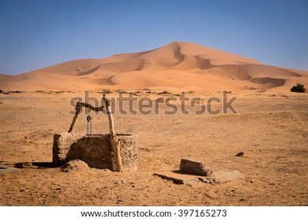 Old well on Sahara Desert, Merzouga, Morocco Royalty-Free Stock Photo #397165273