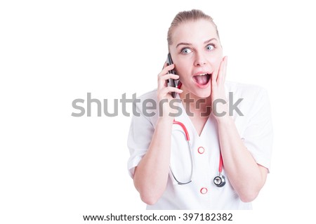 Happy surprised female doctor or medic talking on the phone smiling isolated on white background with copy space and advertising area