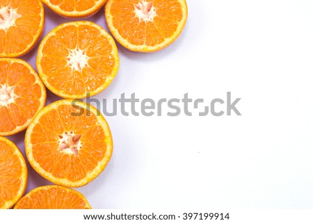 group of halves oranges at left side on isolated white background