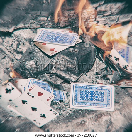 Playing cards burn in the fireplace 