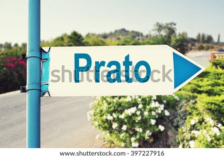 Prato Road Sign with beautiful nature and road on background