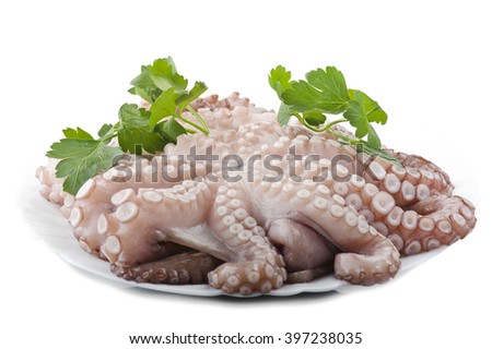 fresh octopus with potatoes and parsley on white plate