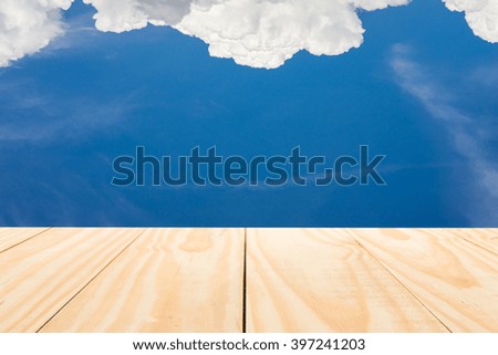 Wood table top on natural cloud and blue sky background - can used for display or montage your products

