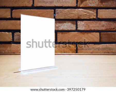 Mock up Menu Frame template on table Bar Brick wall background