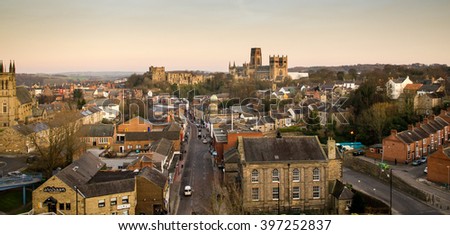 The view of the city of Durham, including the castle and cathedral, from the railway viaduct at sunset. Royalty-Free Stock Photo #397252837
