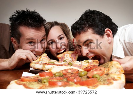 The cheerful company of youth eating a pizza Royalty-Free Stock Photo #39725572