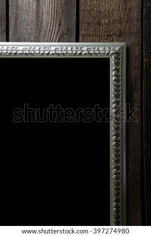 Vintage frames on wooden background with space for text