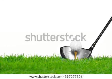 Golf ball on tee in front of driver isolated on white background