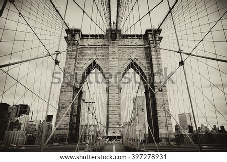 Brooklyn Bridge, New York, USA. Beautiful view of Manhattan, downtown, NYC. Midtown panorama in financial district. Business and travel background. Vintage, retro postcard with sepia filter.