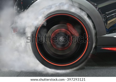 sport car wheel drifting and smoking on track dark edition  Royalty-Free Stock Photo #397293121