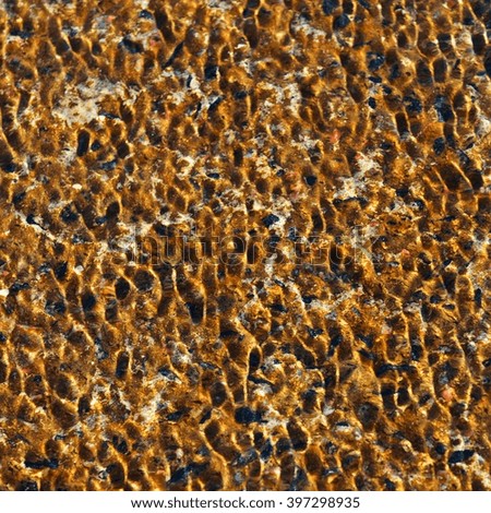 Water ripple texture with orange sand background