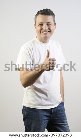 Attractive adult man agree with thumb up isolated on a white background