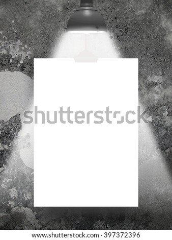 Close-up of one blank frame hanged by clip with lamp against concrete wall background