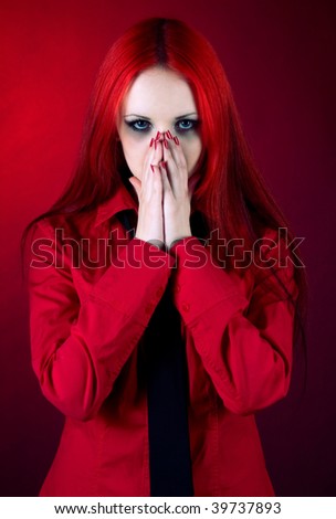 beautiful sad girl on a red background