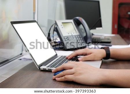 close up employee man working/typing at notebook in office room Royalty-Free Stock Photo #397393363