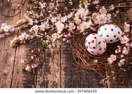 Easter concept with colorful eggs on wooden background