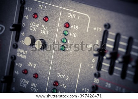 Color image of many buttons in a sound recording studio.
