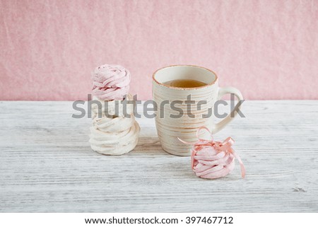 Homemade sweet pink and white marshmallow - zephyr on a light wooden table. Selective focus