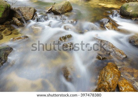 Ton Nga Chang waterfall at Songkhla Southern Thailand:Select focus with shallow depth of field:ideal for use as a background.
