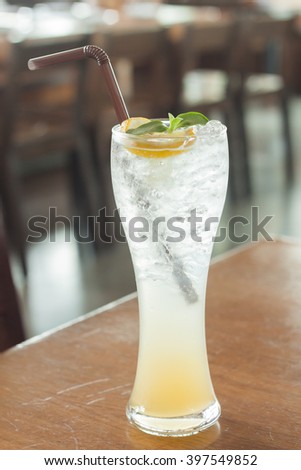 Glass of iced honey lemon soda, stock photo