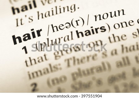 Close up of old English dictionary page with word hair