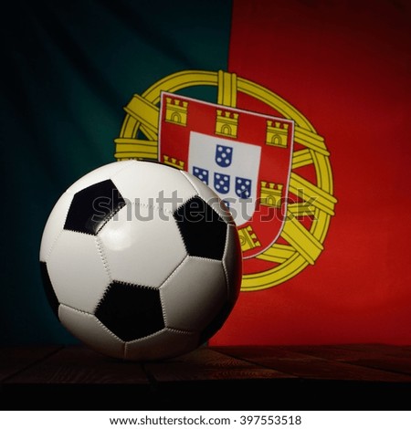 Flag of Portugal with football on wooden boards as the background. MANY OTHER PHOTOS FROM THIS SERIES IN MY PORTFOLIO.