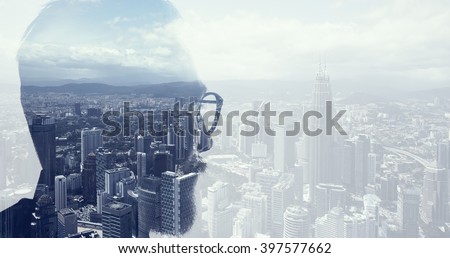 Closeup photo of bearded banker wearing glasses and looking city. Double exposure, panoramic view contemporary megalopolis background. Space for your business message. Wide