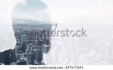 Photo of stylish bearded lawyer wearing trendy suit and looking city. Double exposure, panoramic view contemporary City background. Space for your business message. Wide