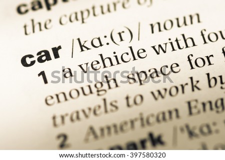 Close up of old English dictionary page with word car Royalty-Free Stock Photo #397580320