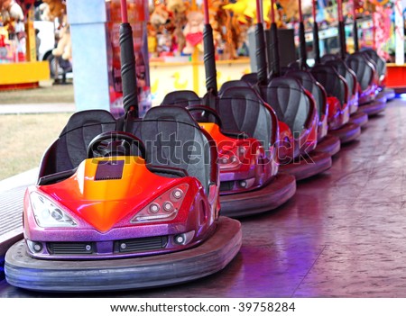 A Row of Dodgem Cars on a Fun Fair Amusement Ride. Royalty-Free Stock Photo #39758284