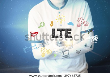 Young man holding a smart phone  with LTE text ,business concept 