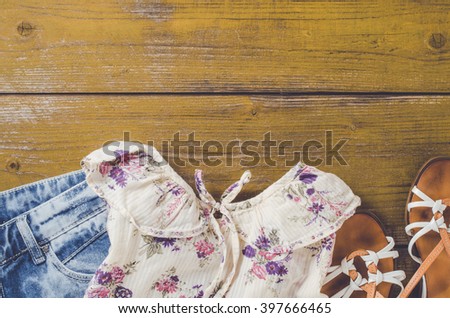 Women outfit on an old wooden table