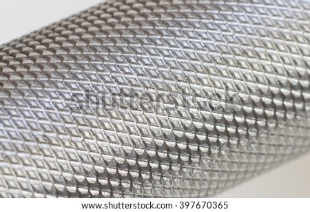 Corrugated steel handle macro. Diamond knurling pattern.