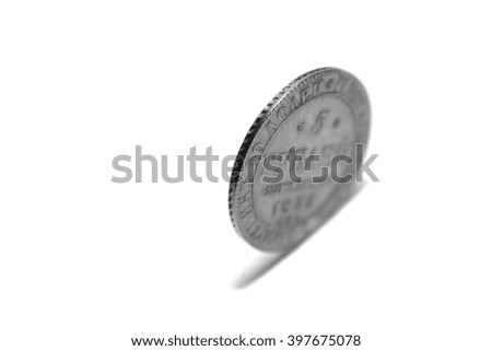 One coin, isolated on white background, black and white photo
