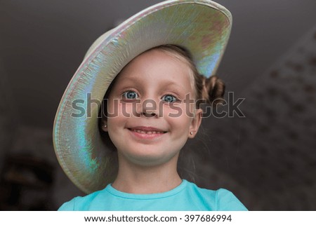Funny girl in a hat on the Fool's Day

