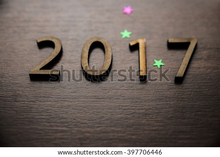 Sigh symbol from number 2017 on old retro vintage style wooden texture background Empty copy space for inscription or other objects Idea merry new year holiday year of cock