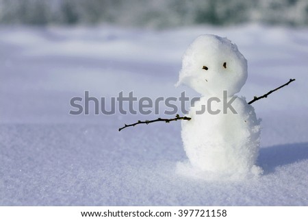 Snowman. Little snowman. New Year card. Winter mood. Lonely snowman on beautiful background. Snowman. Cute picture with a snowman