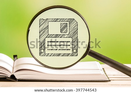 Backup information with a pencil drawing of a disk in a magnifying glass