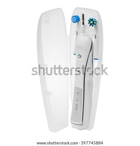 Electronic toothbrush in case with two replacement brush heads isolated on a white background