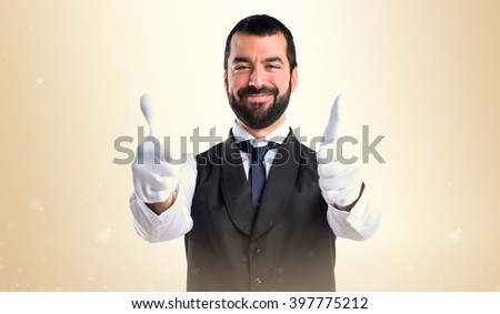 Luxury waiter with thumb up