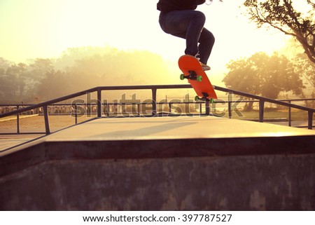 skateboarding legs at sunrise skatepark