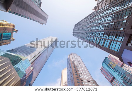 Looking up at business buildings in downtown New York, USA