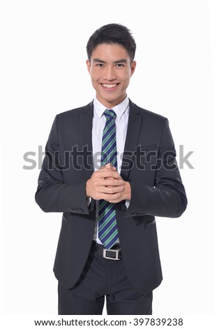 A confident young businessman stands â??white background