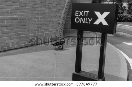 Black and white horizontal Exit Only traffic sign