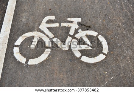 White painted sign for bikes.Bicycle sign or icon in the park.