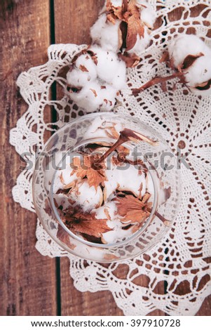 Cotton flowers on a wooden background