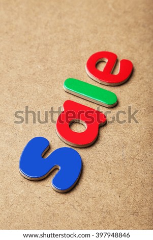 Sale word made of colorful magnets